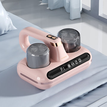 Green Nuvora cordless mattress and upholstery vacuum positioned on a mattress
